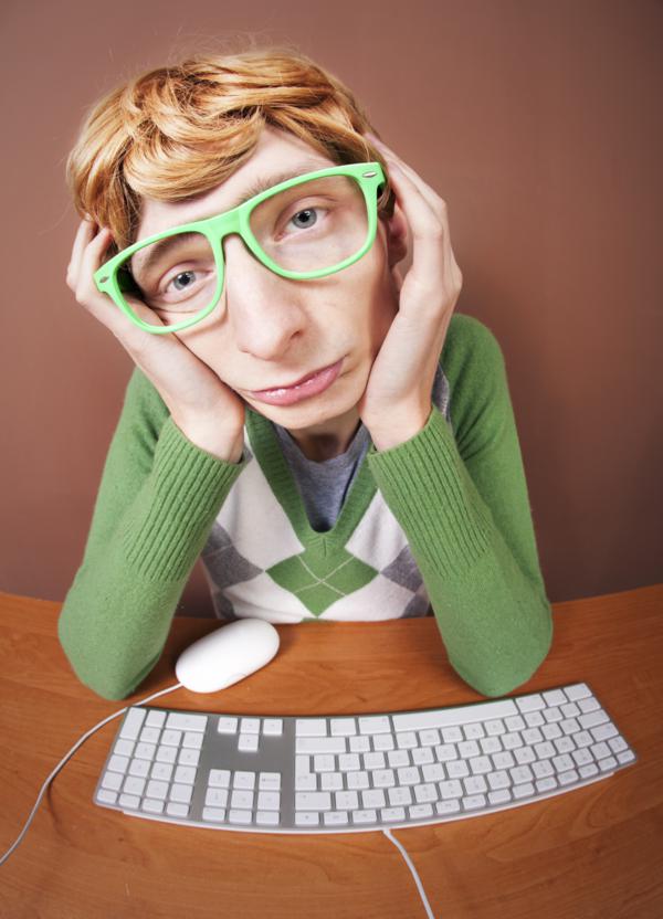 Sad nerdy guy at the computer